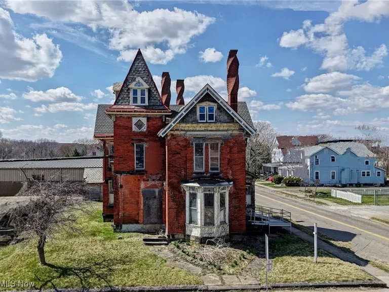 Check out those spiral chimneys! C. 1877 historic brick home in Ohio. $118,770.