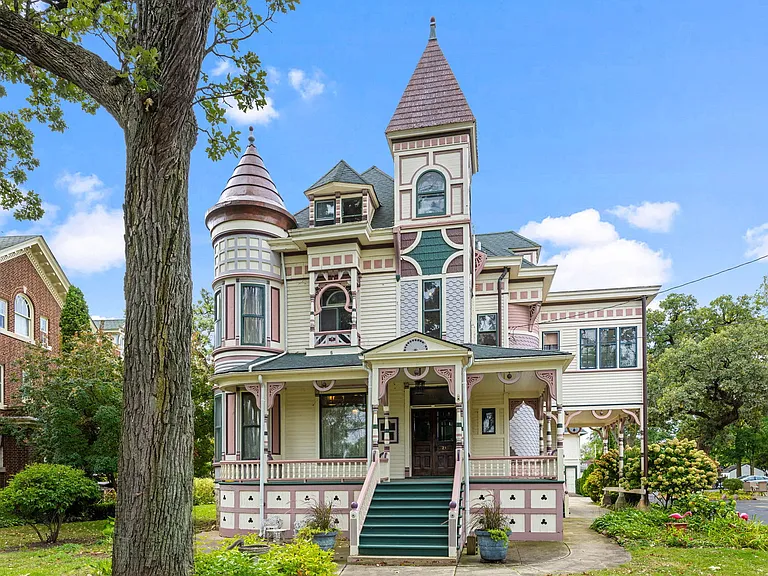 Check out the staircase!! Incredible woodwork and inlaid floors. C. 1889 in Illinois. $500,000.