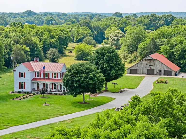 Beautiful wraparound porch! 8 level acres in Tennessee. $739,900.