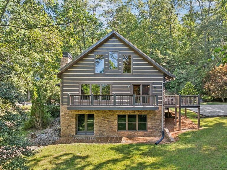 Pretty woodwork and stone fireplace! C. 2004 in the heart of Polk County. $850,000.