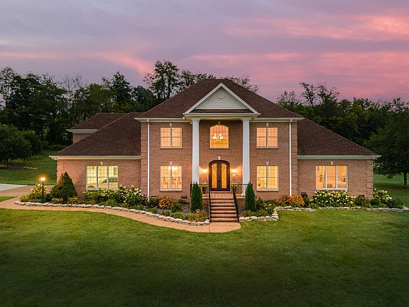 Check out the shops!! Professional 10-car garage on 22 acres in Tennessee. $1,950,000.