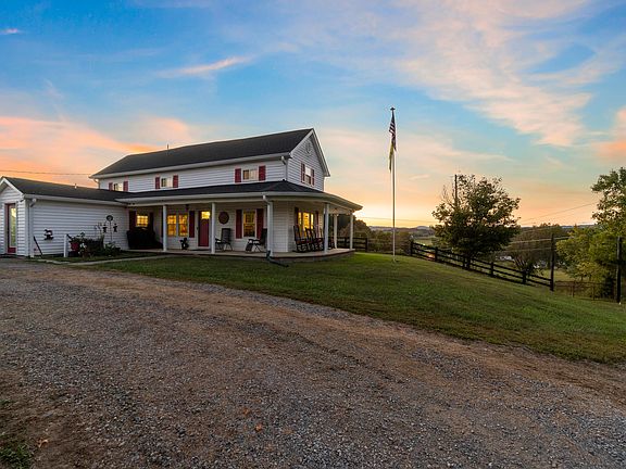 Pretty floors and stone fireplace! Historic Greeneville estate on 50 acres. $814,900.