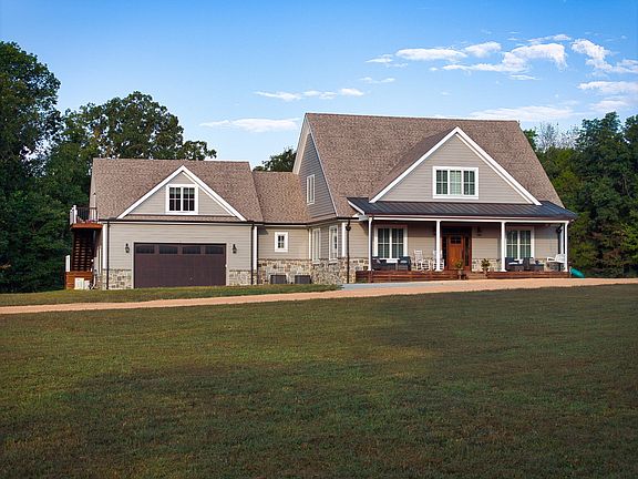Pretty creek and setting! Luxury custom home on 176+ acres in TN. $3,480,000.