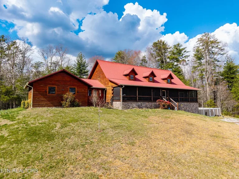 Mountain views and custom wood! Nearly 5 acres in Tennessee. $789,900.