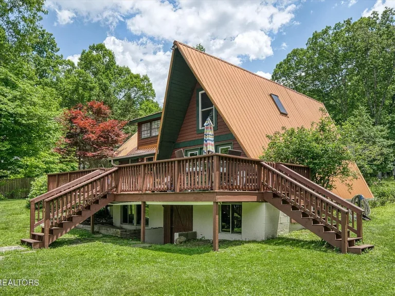 Stunning water views and private dock! Updated A-frame in Tennessee. $359,900.