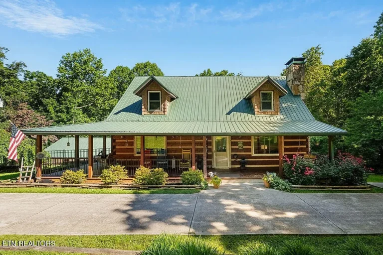 Pretty porch and setting! Private log home in Roane County. $779,900.
