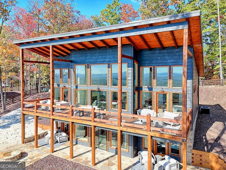 Check out that fireplace!! Modern rustic cabin on over an acre in Georgia. $599,000.