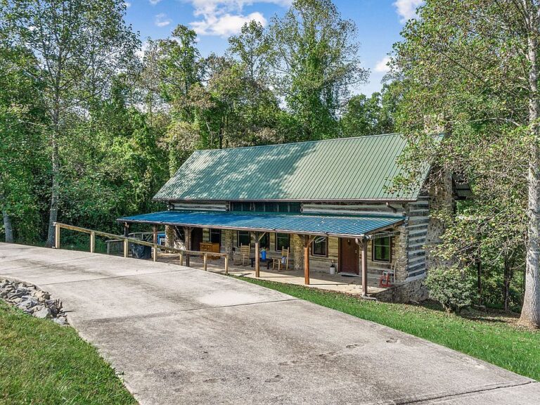 Historic charm and lake vibes! Reconstructed 1850s log cabin in Tennessee. $449,000.