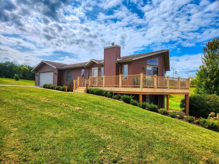 Great getaway spot! Ranch with two garages on nearly an acre in Illinois. $339,000.