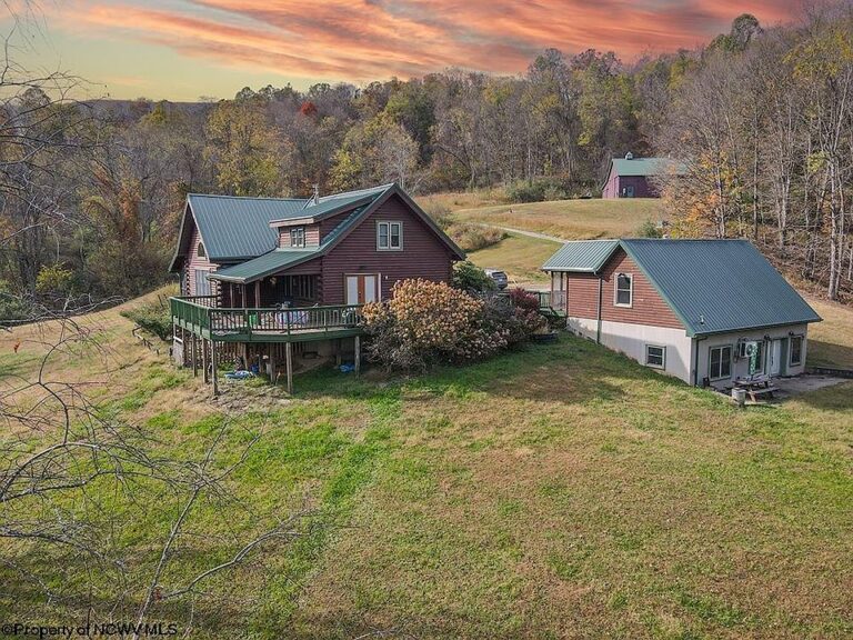 Mountain views and a stocked pond! 60 acres in West Virginia. $700,000.