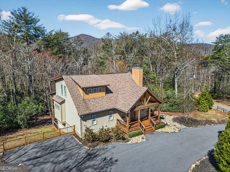 Pretty wood details and porch! Over an acre in Georgia. $575,000.