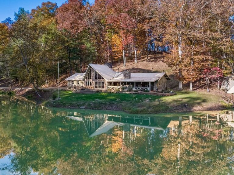 Check out the pond! Custom log home on 29+ secluded acres in Ohio. $1,100,000.