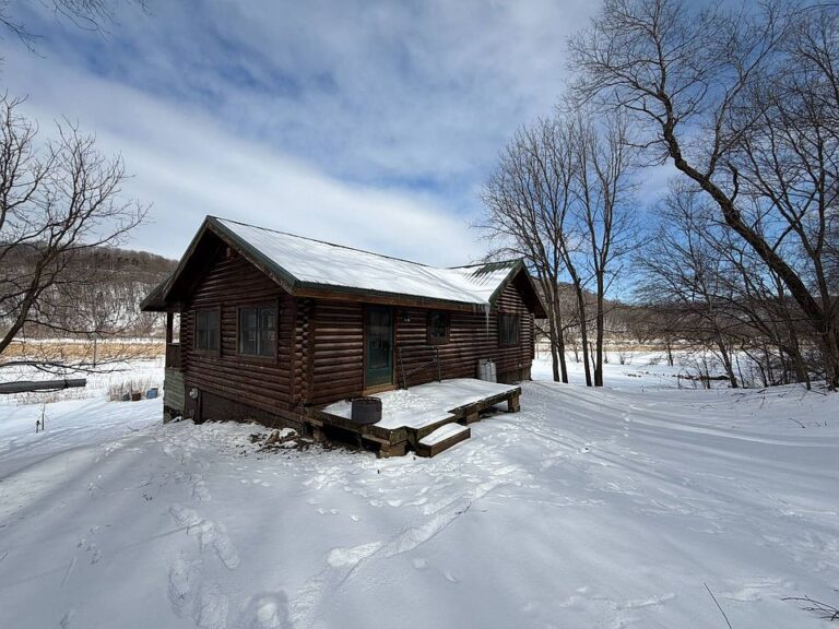 Beautiful Log Cabin! C. 2004 with river views in Iowa. $269,900.