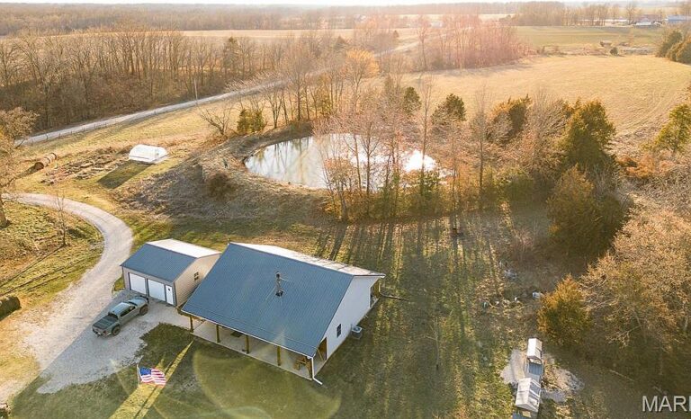 Look at that wood stove! Rustic retreat on 40 acres in MO. $564,900.