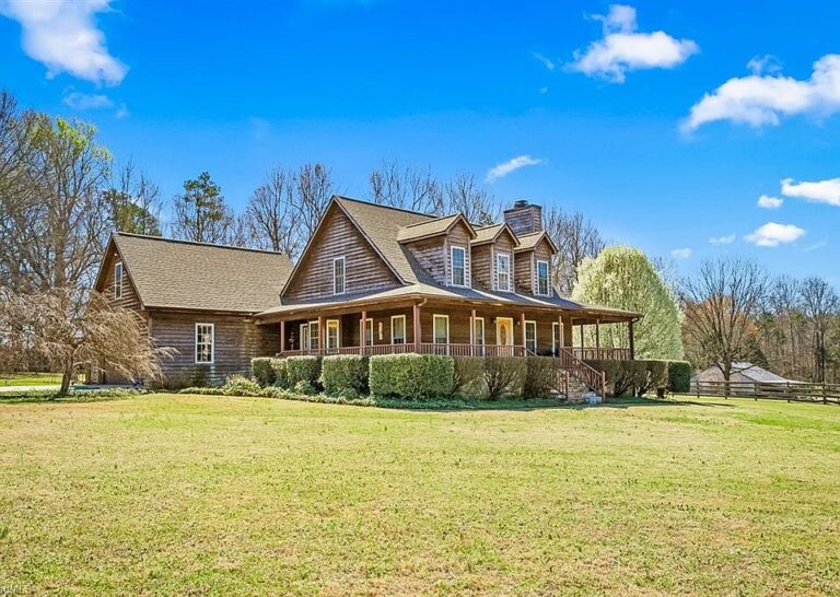 Check out the wrap-around porch!! Turn-key horse property in Lexington. $649,999.