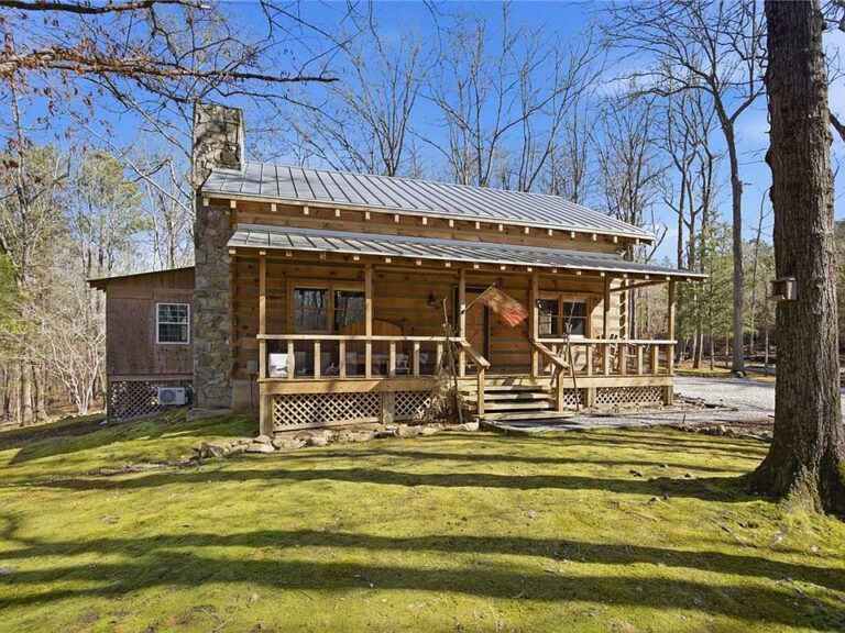 Pretty wood floors and pond! C. 1986 log home in SC. $510,000.