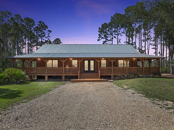 Beautiful sunset views! Modern log cabin living in North Florida. $1,600,000.