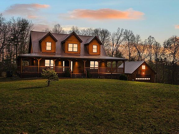 Beautiful wraparound porch! C. 2008 in Rogers, Kentucky. $735,000.