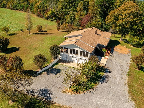 Check out the glass sunroom! Over 5 acres in Tennessee. $369,000.