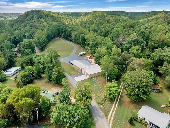 Great getaway spot! Massive workshop and swim spa on 13+ acres in TN. $990,000.
