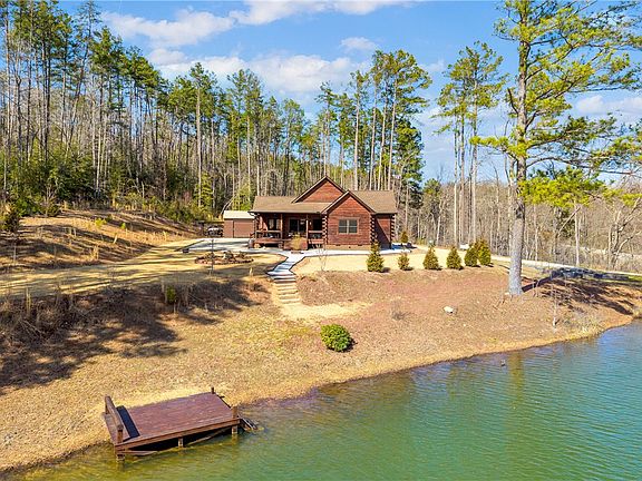 Pretty wood finishes! C. 2024 cabin with a private dock in South Carolina. $549,000.