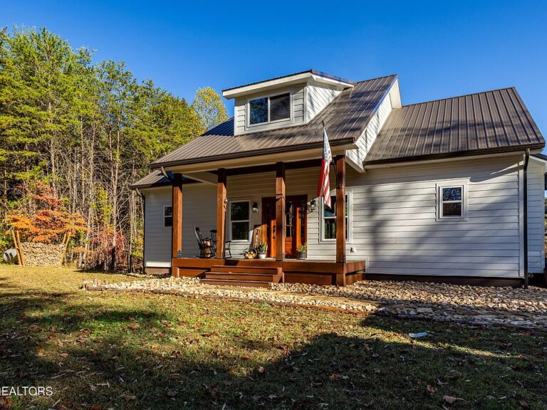 Check out the barnwood floors! Brand new farmhouse on 44 acres in TN. $1,295,000.