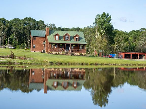 Pretty stone fireplace! Modern farmhouse on 35+ acres. $747,000.
