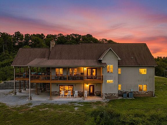 Check out those floors! Stunning 2014 custom build on 63+ acres. $1,950,000.