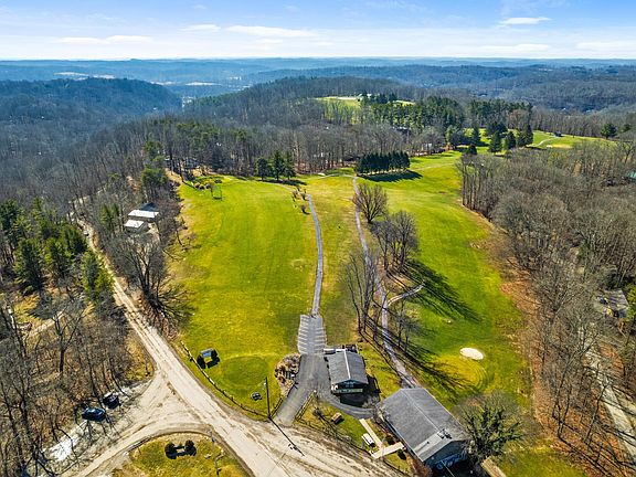 Beautiful modern updates! Original woodland retreat on 0.54 acres in Ohio. $265,000.