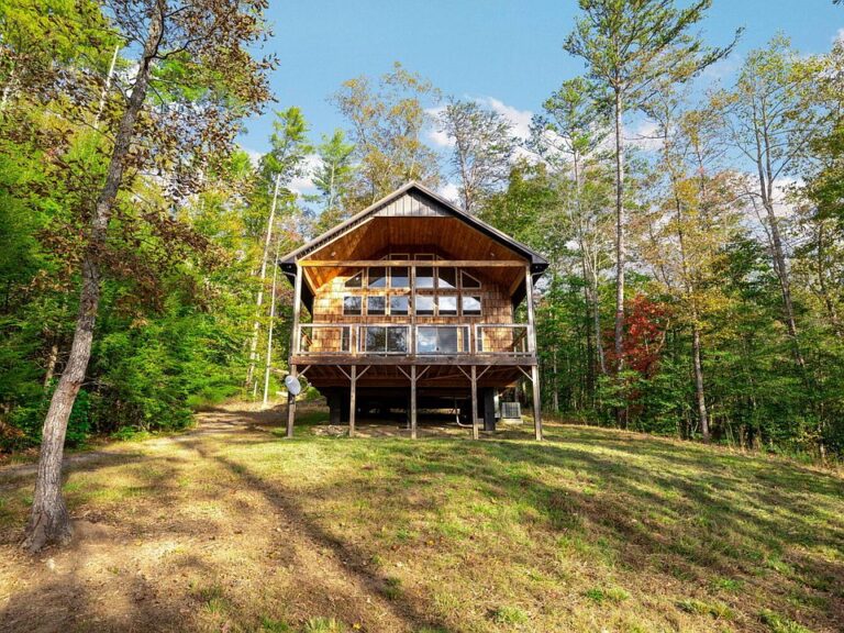 Check out those wood ceilings! Custom cabin on 38.5 acres in Reliance. $799,000