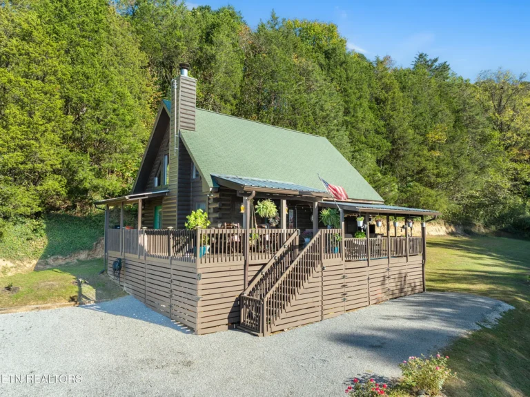 Pretty island and pond! Private 8.58-acre retreat in Sharps Chapel. $459,900.