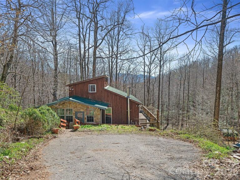 Pretty creek and stone fireplace! One acre in North Carolina. $215,000.