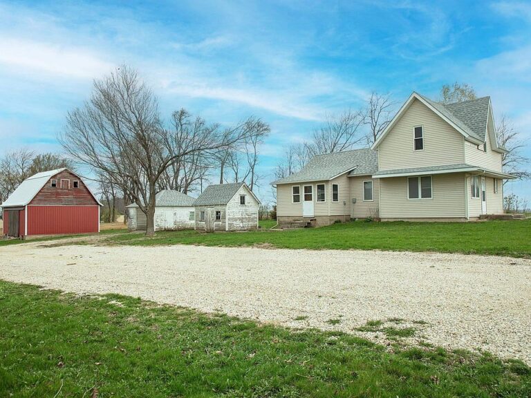 Check out that setting!! Historic 1890 farmhouse on 2.38 acres. $109,000.