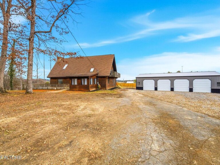 Massive garage and workshop! 4-bedroom cabin on over an acre in TN. $488,900.