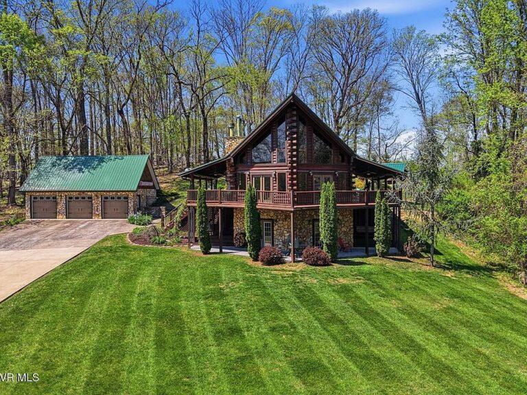 Check out the outdoor fireplace!! Custom log home on 17 acres in Tennessee. $895,000.