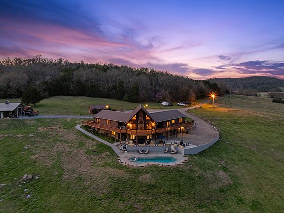 Breathtaking views and a heated pool! Nearly 70 pristine acres in Tennessee. $2,200,000.