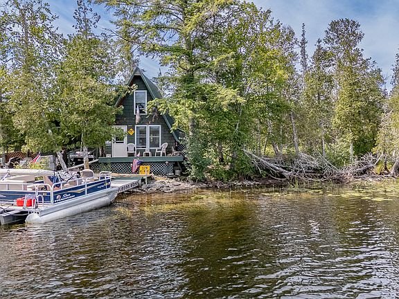 Private island escape! Rustic A-frame on the Sebec River in Maine. $149,900.