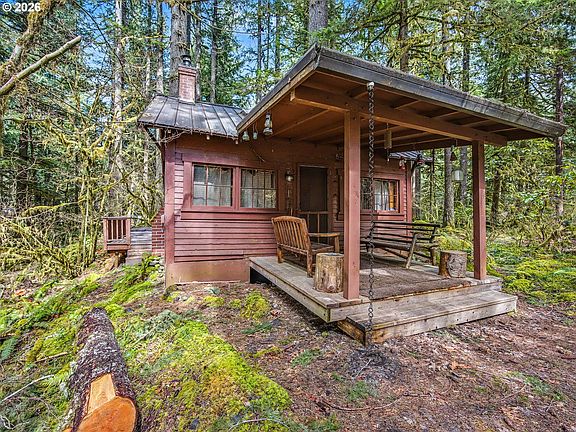 Check out that Smeg fridge! C. 1928 forest cabin in Oregon. $299,000.