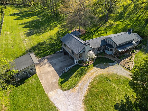 Real rock fireplaces! Over 6 acres and a creek in Tennessee. $2,400,000.