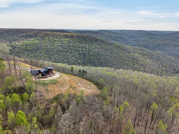 Pretty mountain view and a wrap-around porch! 5 acres in Tennessee. $349,900.