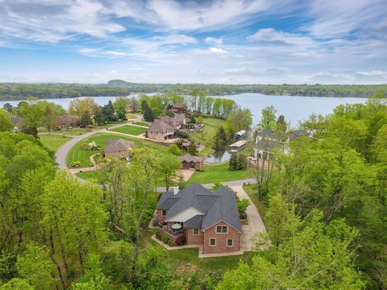 Stunning wraparound porch! 1.9 acres with river views in Tennessee. $849,900.