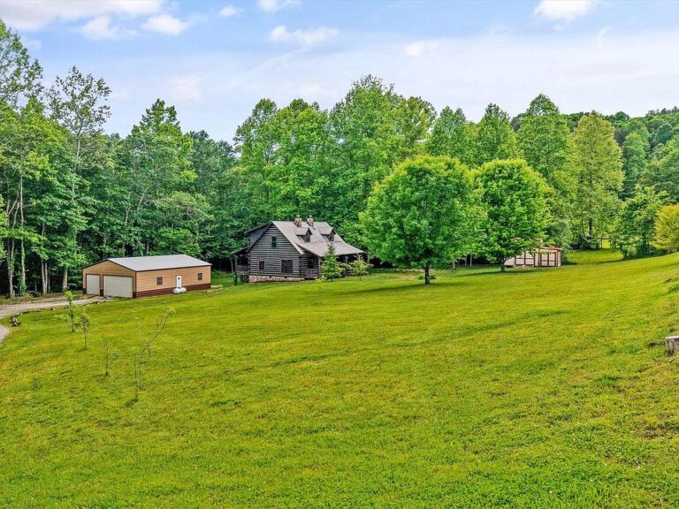 Pretty creek and mountain setting! Custom log cabin on 5 acres in Tennessee. $689,900.