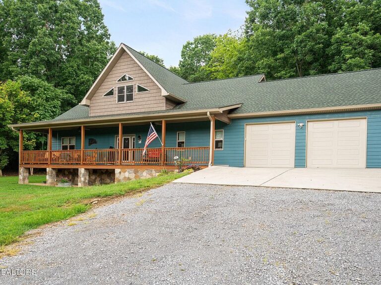 Check out those 30-foot ceilings! Custom home on 7 private acres in Tennessee. $990,000.