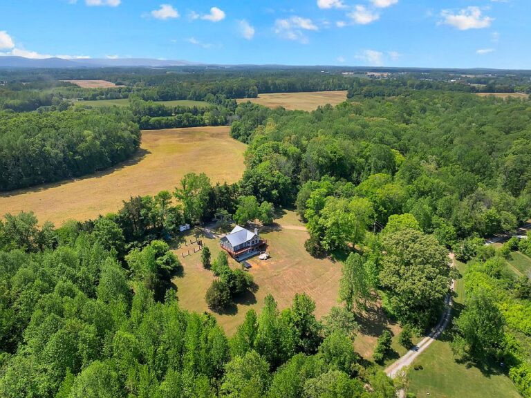 Spring-fed creek and huge deck! Over 12 acres in Tennessee. $719,000.
