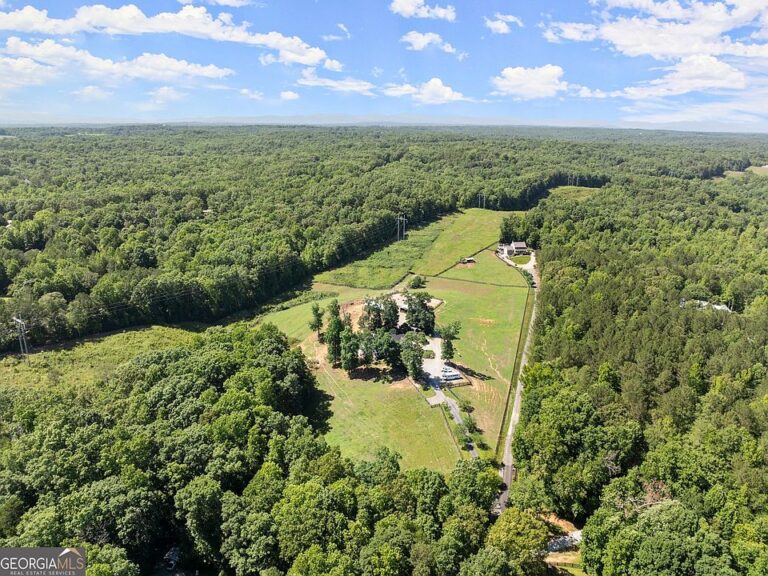 Beautiful black board fencing! 10-acre horse farm in Georgia. $1,350,000.