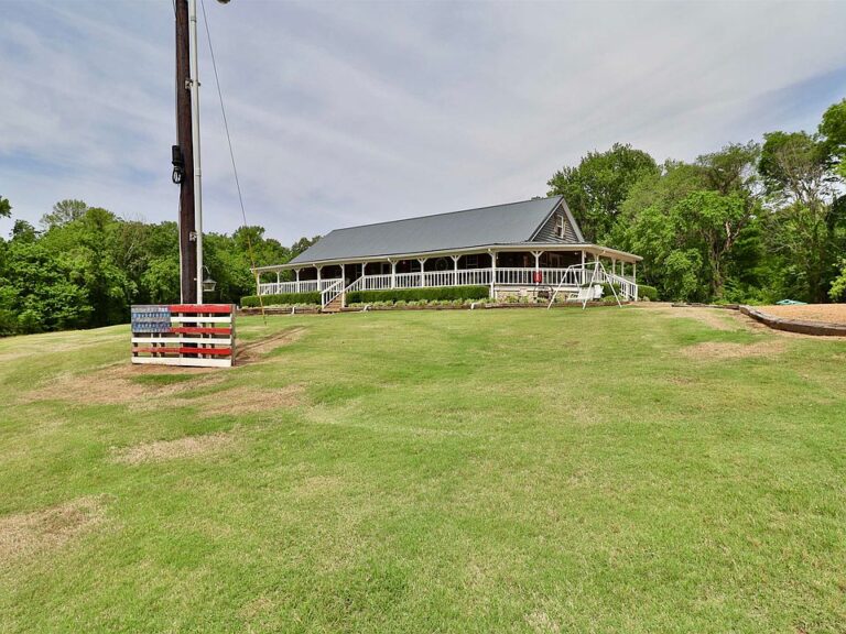 Huge wrap-around porch! C. 2008 on 32 acres in Tennessee. $450,000.