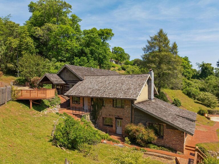 Pretty setting and a koi pond! Over 12 acres in Tennessee. $1,100,000.