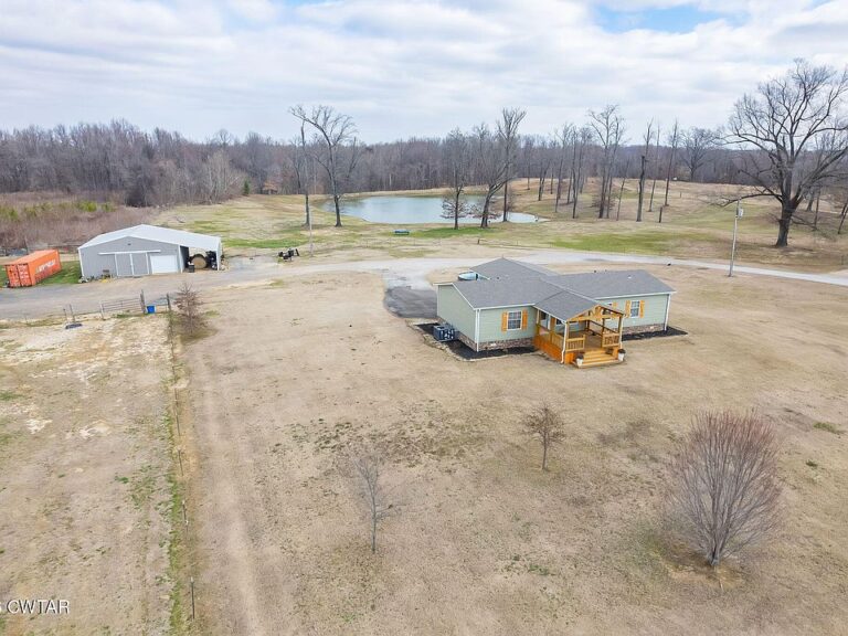 Stocked pond and 57 acres! Renovated farm in Tennessee. $549,900.