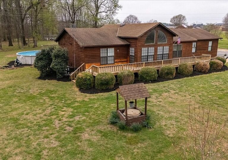 Pretty cedar siding and vaulted ceilings! Nearly 9 unrestricted acres in Tennessee. $365,000.