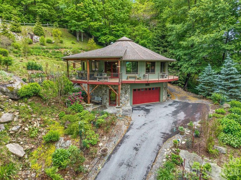 Check out those mountain views!! Deltec circular home on over an acre in NC. $625,000.
